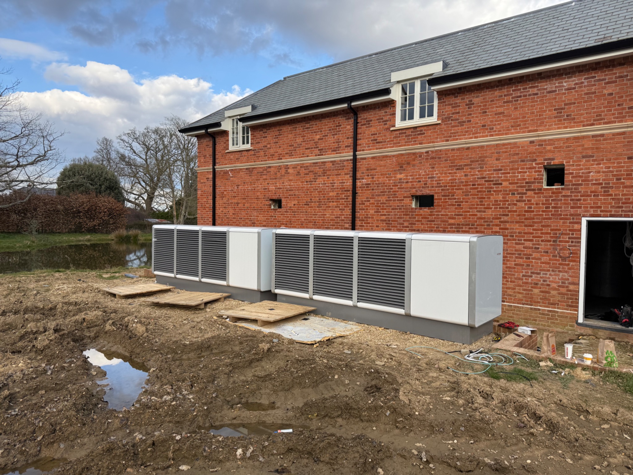 Multi-unit air source heat pump installation serving a substantial residential property.
