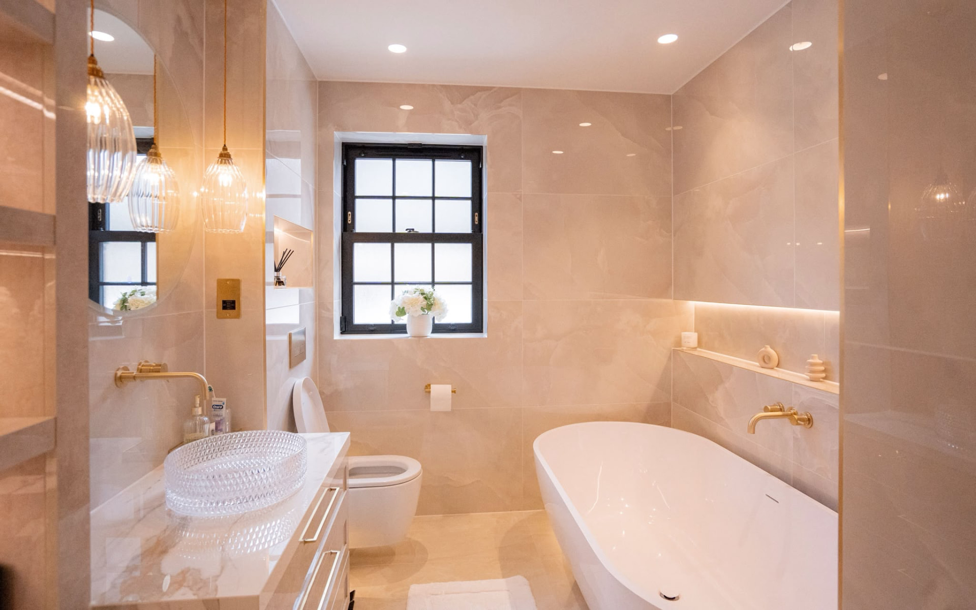 Marble en-suite with concealed cistern and thermostatic brassware
