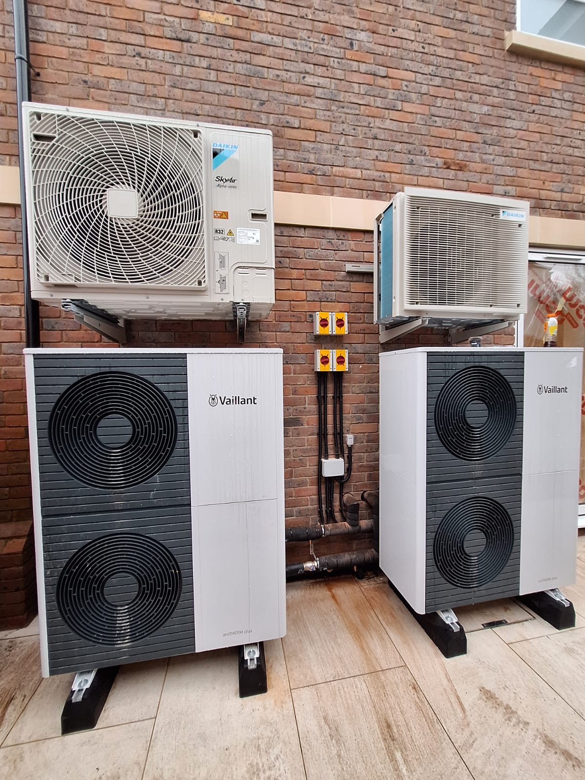 Daikin SkyAir outdoor units integrated alongside renewable heating equipment.