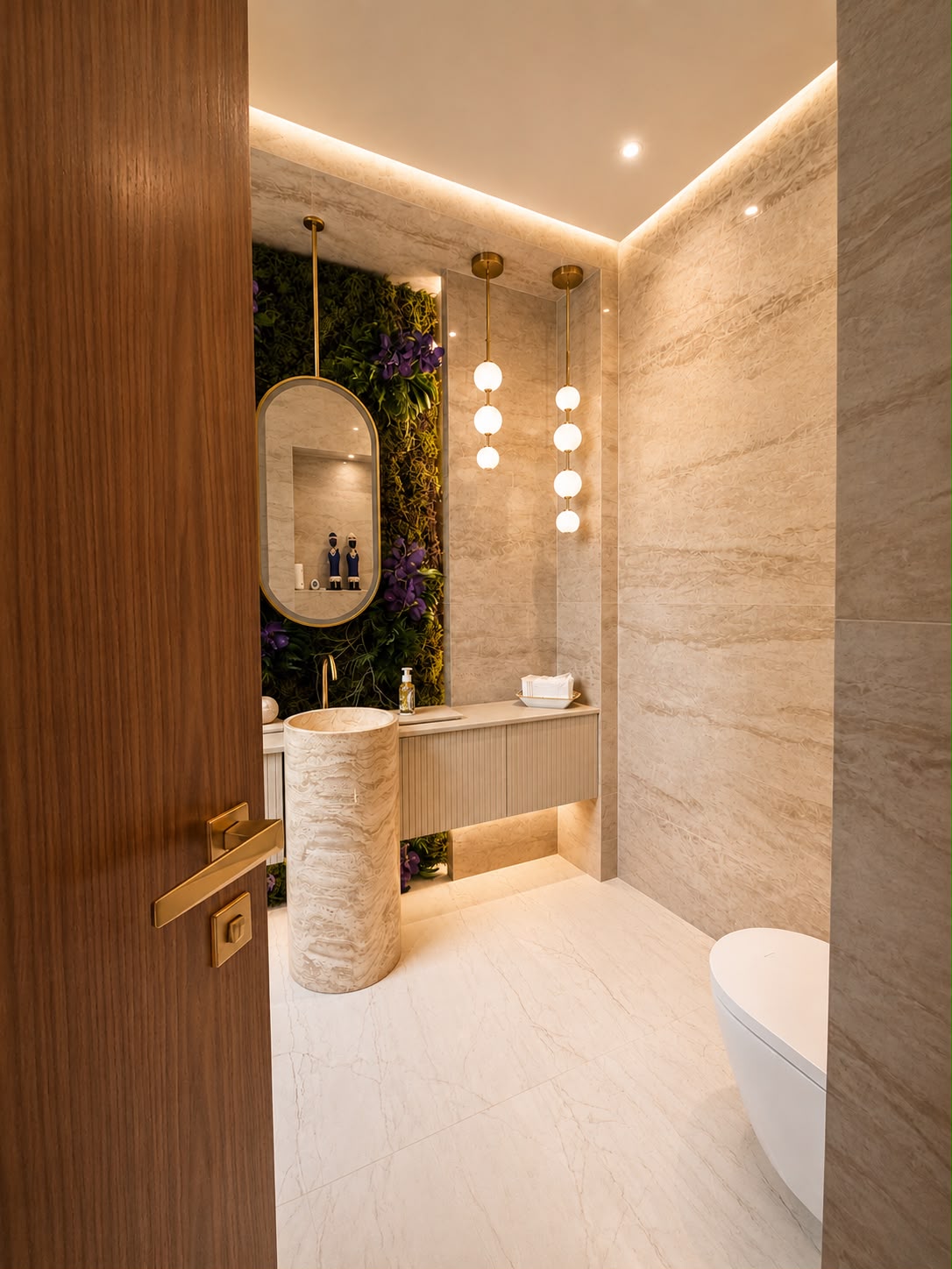 Travertine cloakroom with pedestal basin and feature lighting