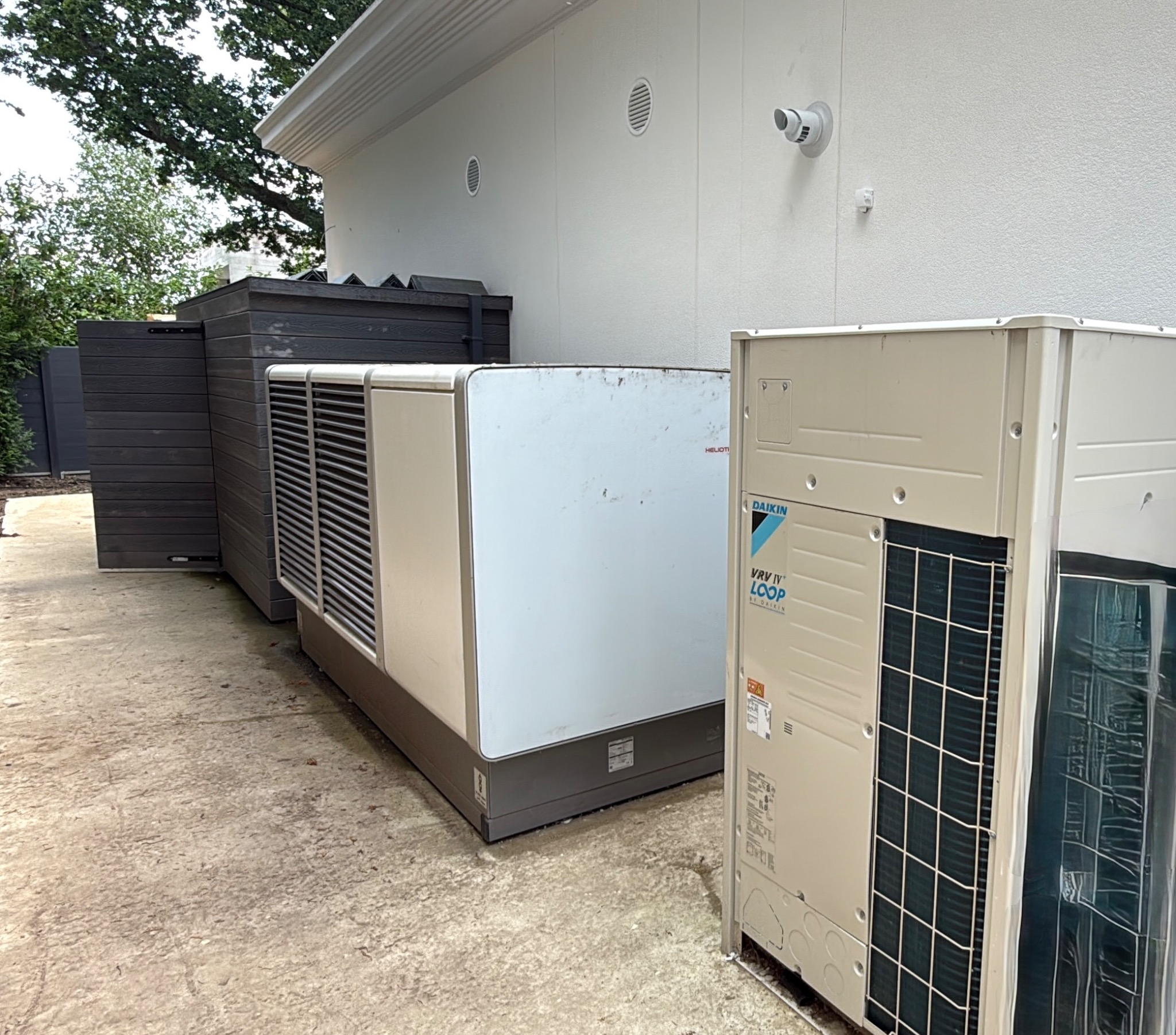 Daikin VRV outdoor plant installed alongside low-carbon heating equipment.