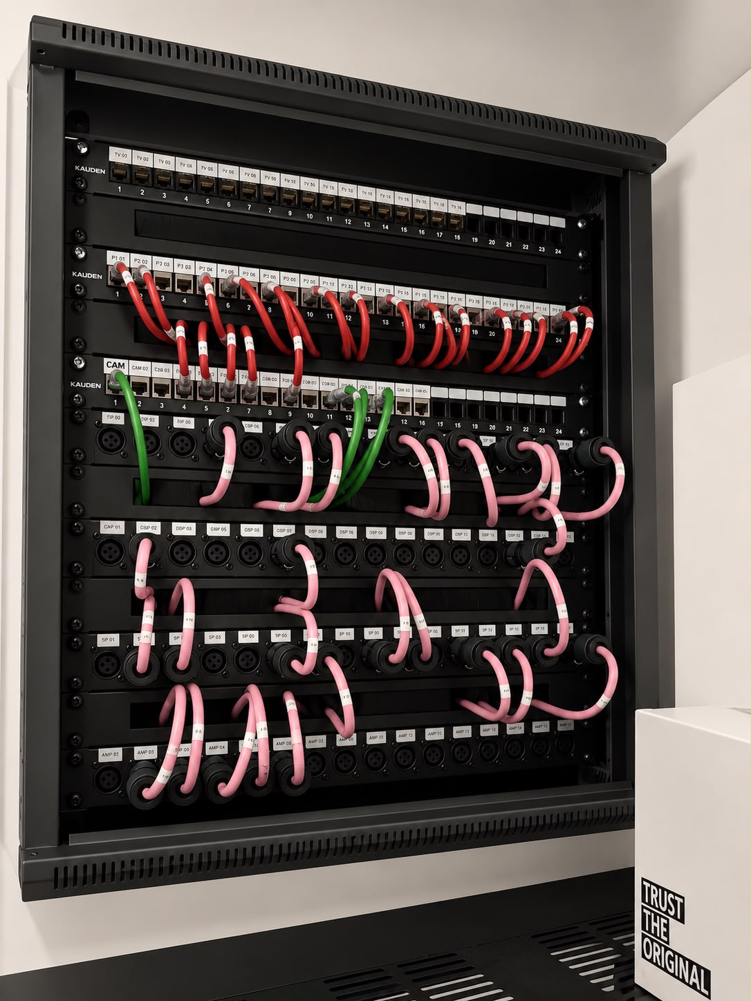 Patch panel with colour-coded, labelled data and audio circuits
