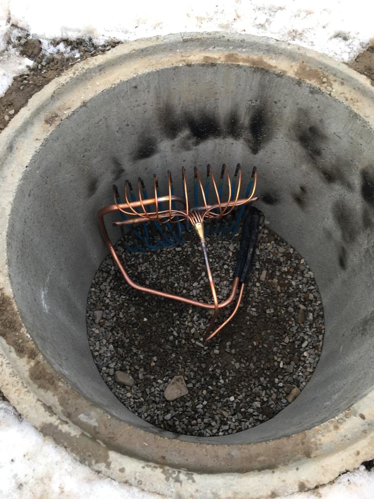 Ground collector pipe connections within an access chamber