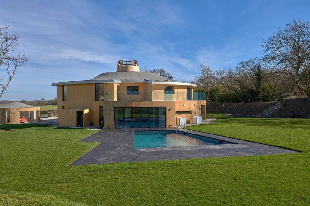 Contemporary residence with an outdoor pool and terrace