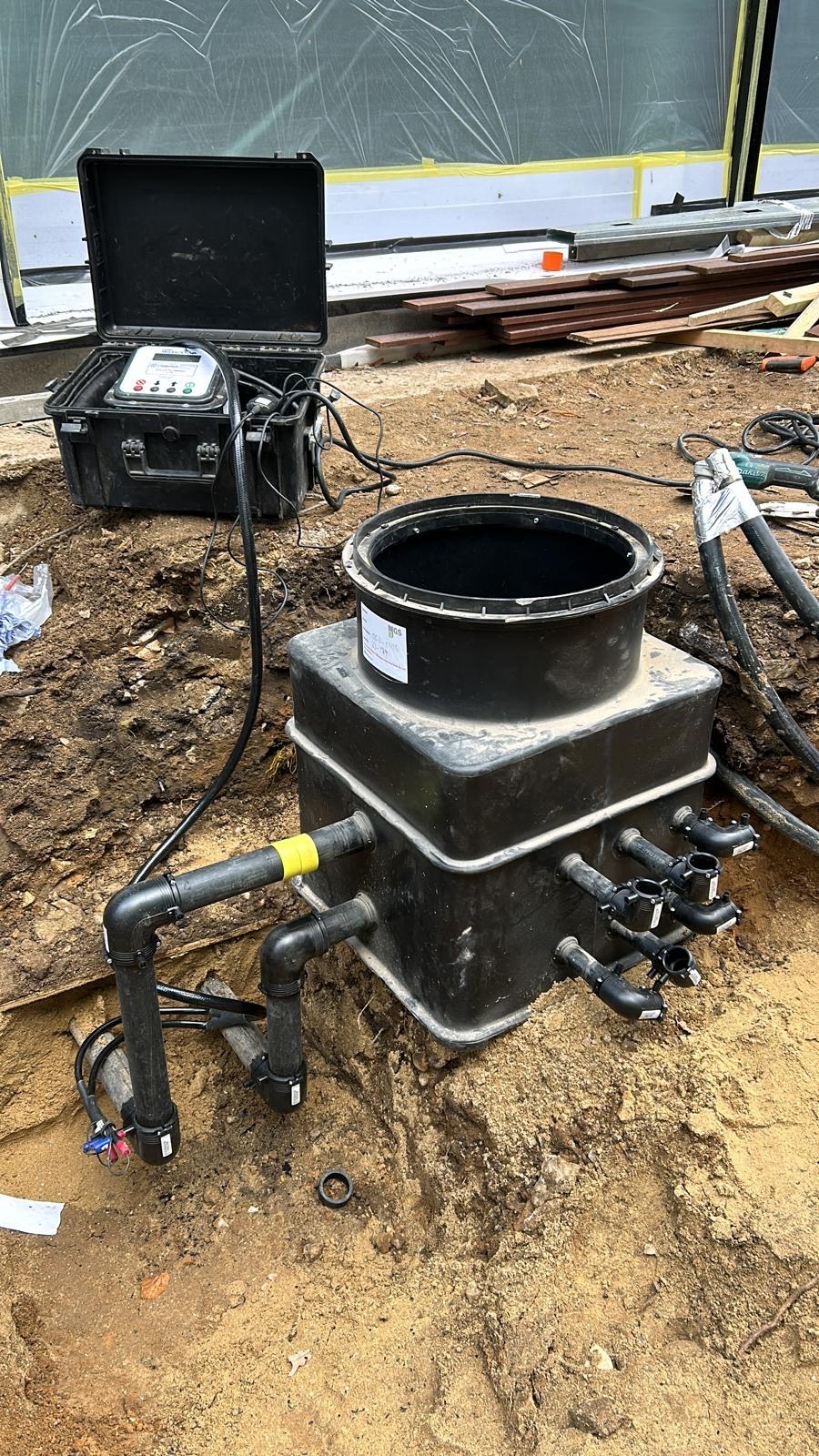 Below-ground ground-array manifold chamber and connected pipework